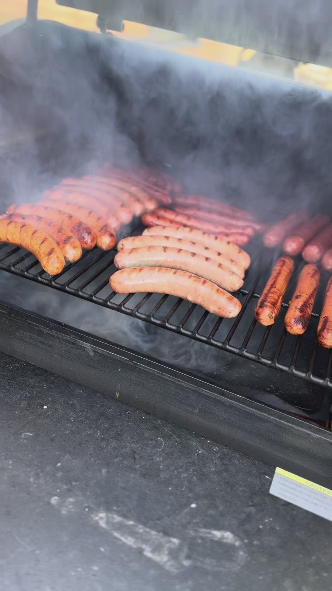 Graze & Roam Ranch grilling pork and beef brats